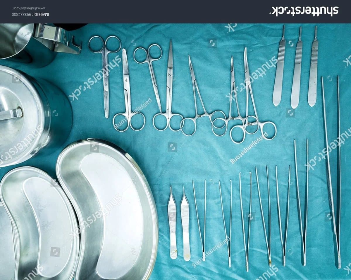 Surgical instruments laid out on a sterile drape